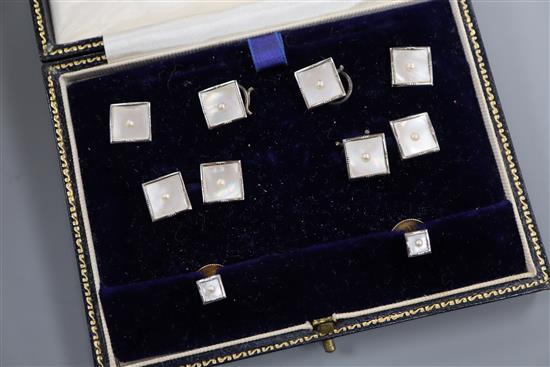 A cased 1950s eight piece 9ct gold, mother of pearl and seed pearl set dress stud set.